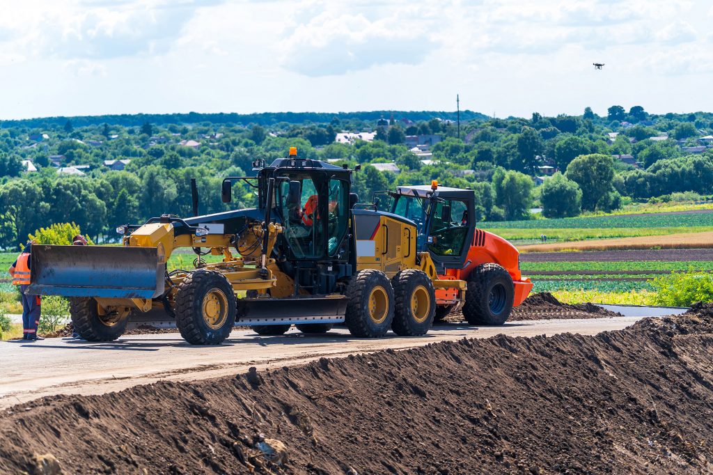Heavy duty bulldozer at work. Heavy special machines. Road constraction, repairing. Selective focus.
